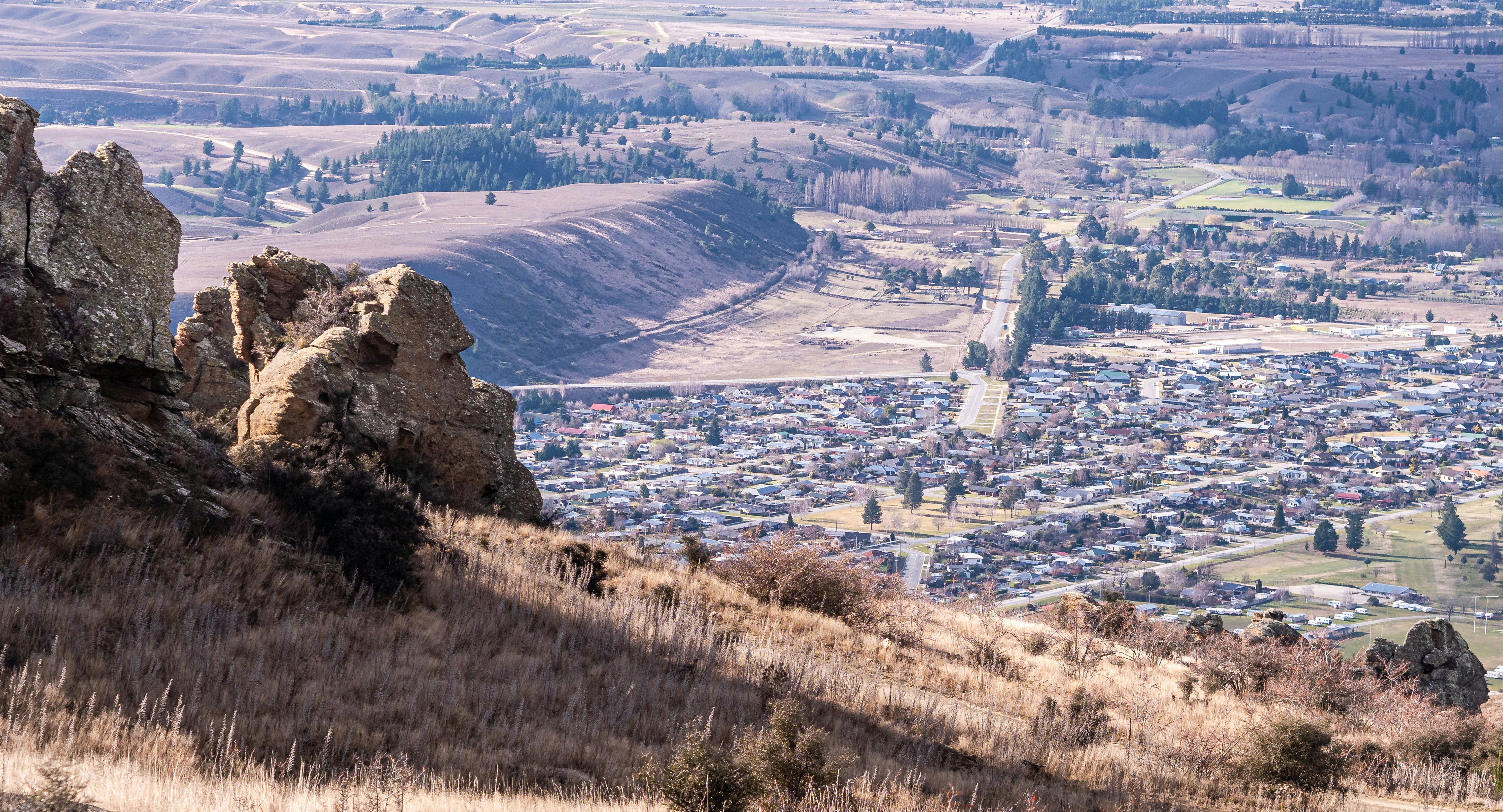 a view of a city from the top of a hill