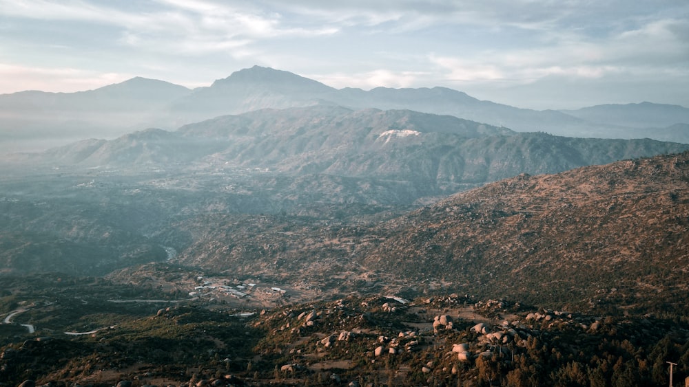 a view of a mountain range with a river running through it