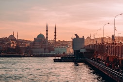 a large body of water with a city in the background