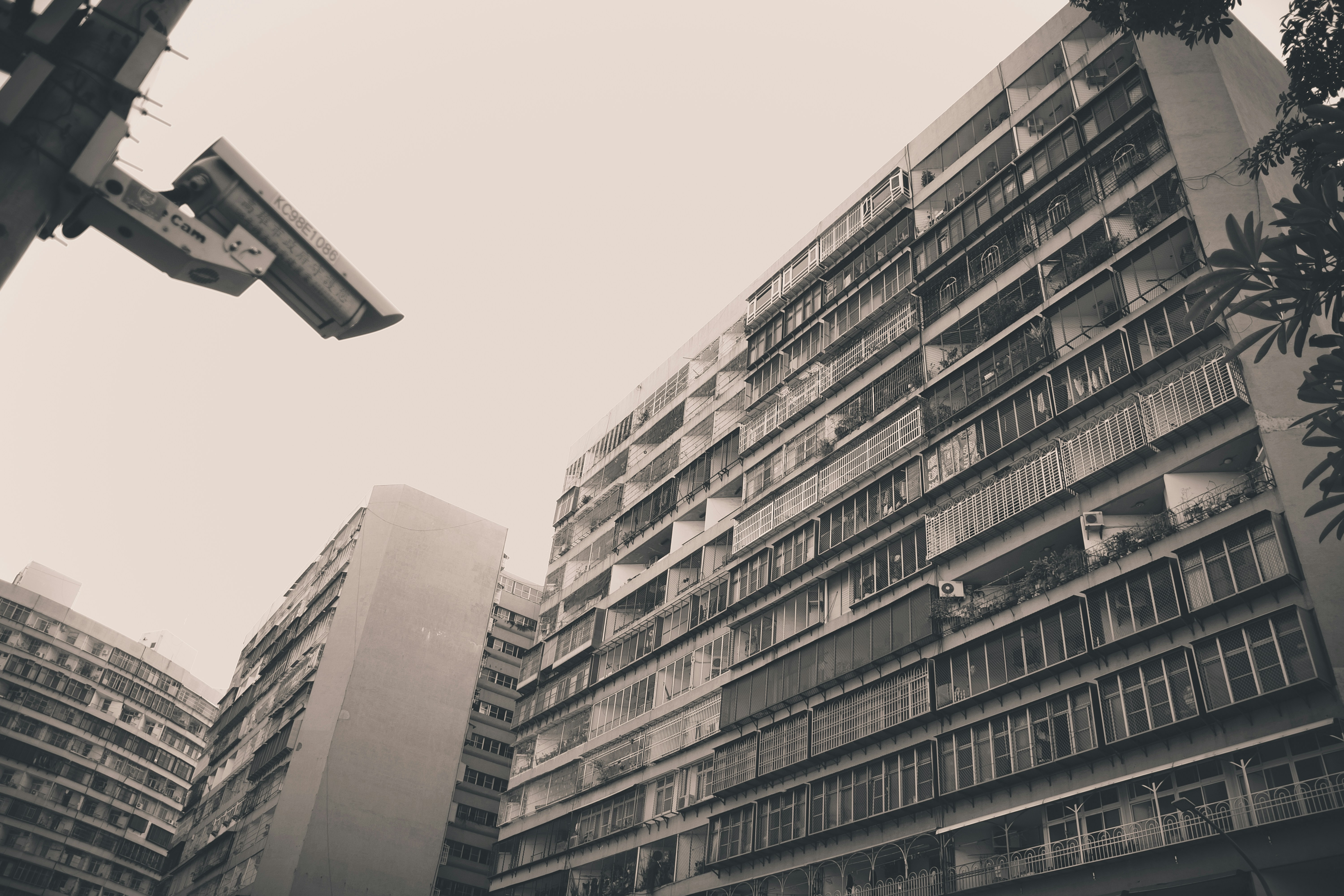 a black and white photo of tall buildings