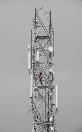 a tall tower with many antennas on top of it