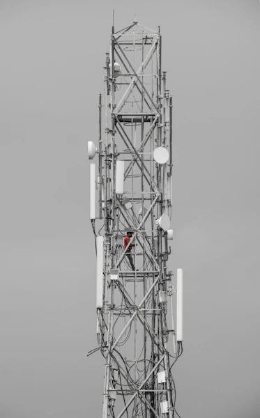 a tall tower with many antennas on top of it