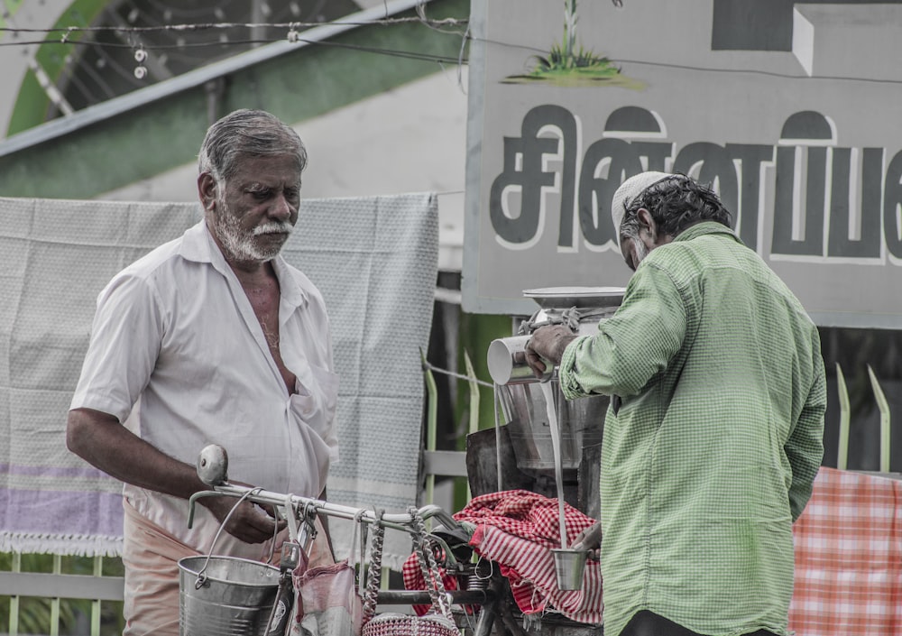 a couple of men standing next to each other