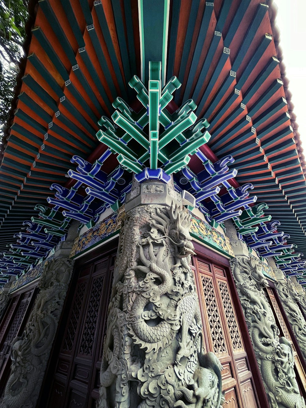 a close up of a building with a decorative roof