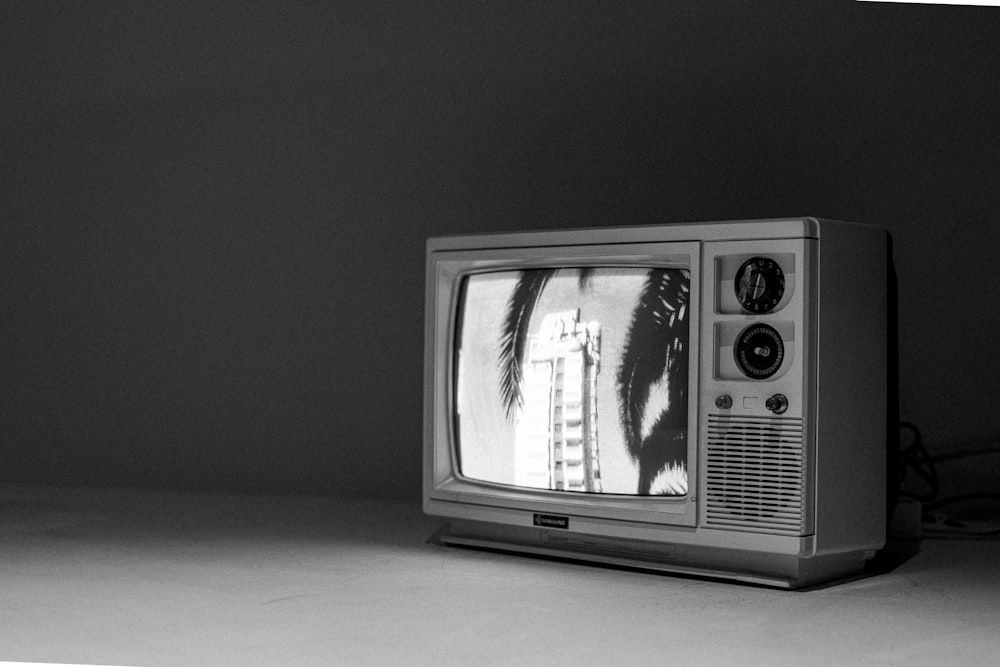a black and white photo of an old tv