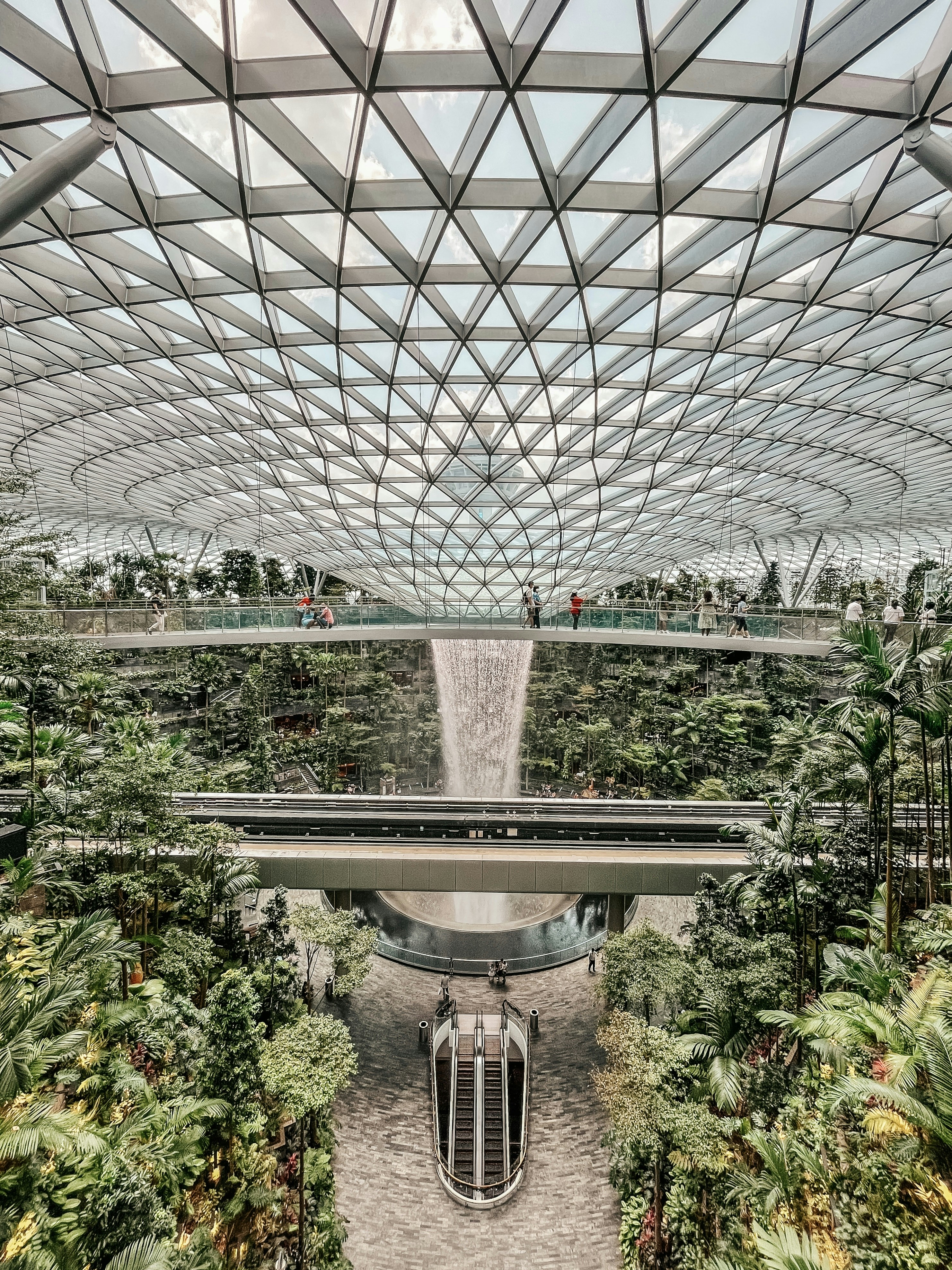 A large building with a waterfall inside of it photo – Free Building ...
