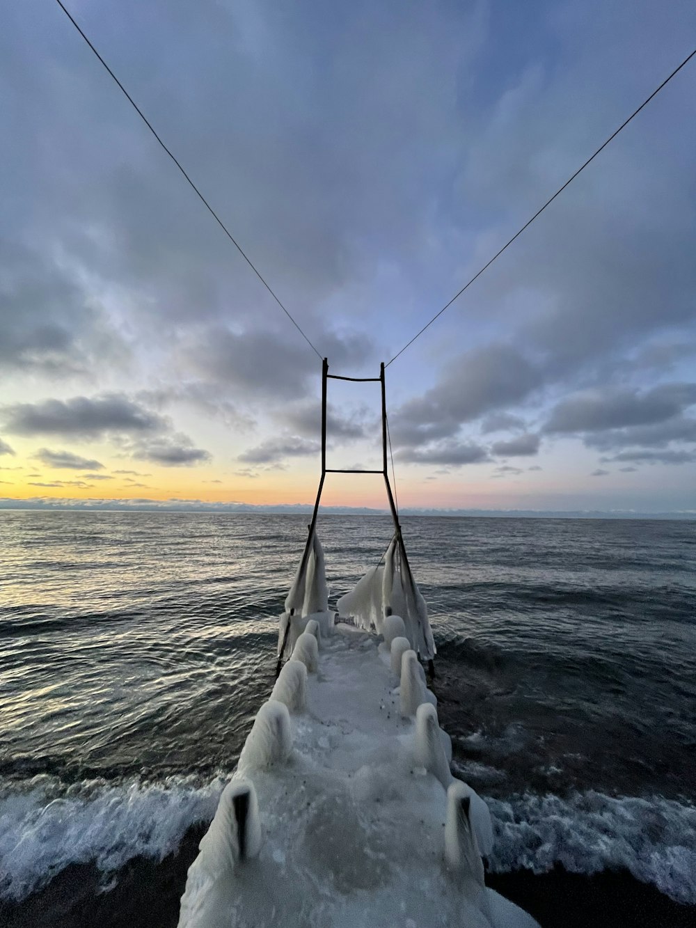 a long wooden bridge over a body of water