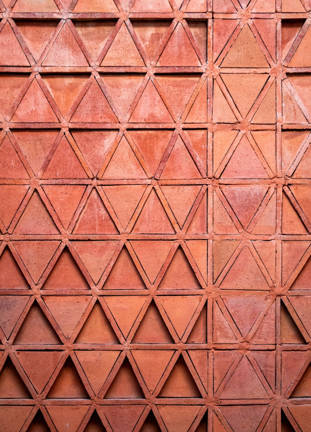 a close up of a wall made of red bricks