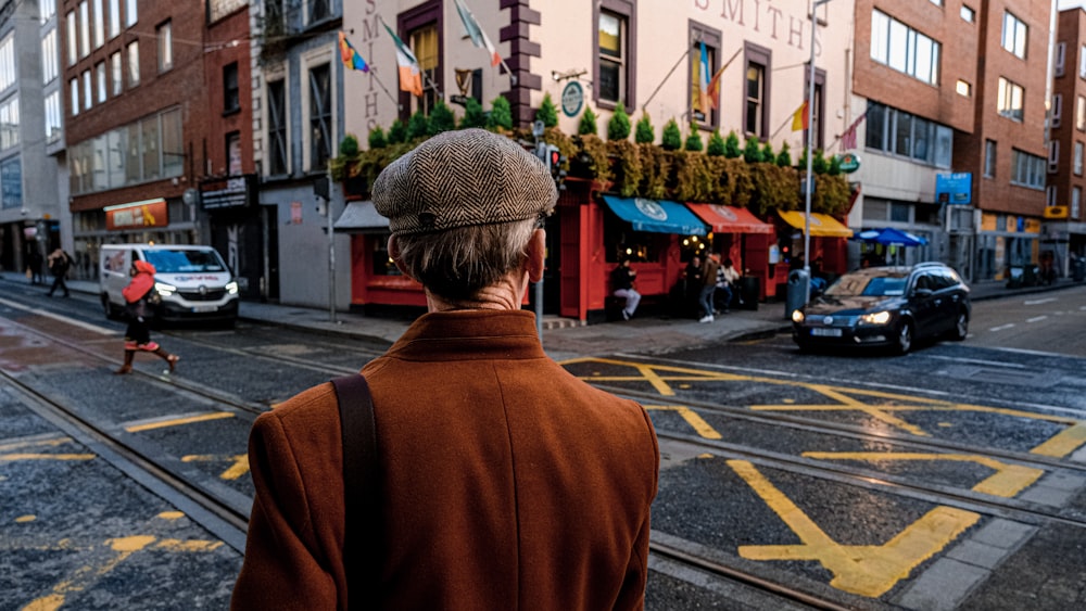 a man standing on the side of a street