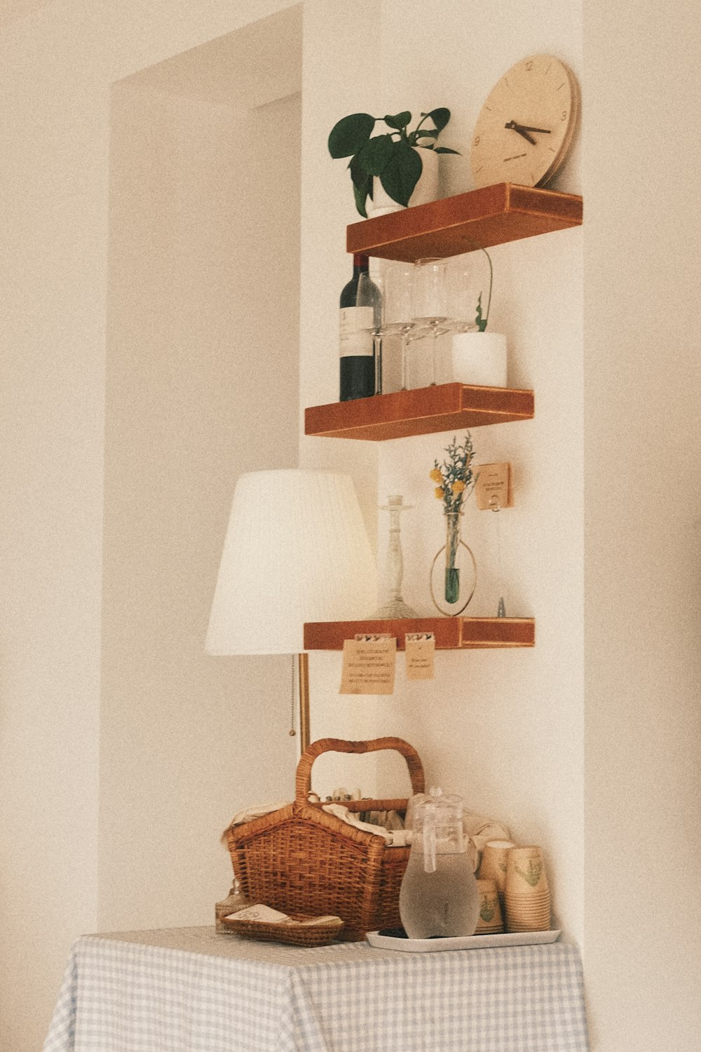 a table with a basket and a lamp on it