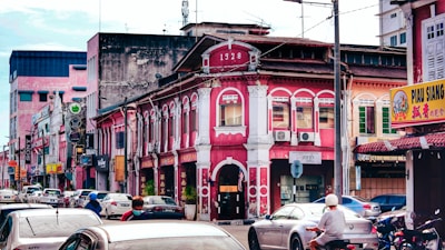 A colorful street scene showing a blend of traditional and modern technology in daily life.