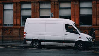 a white van parked on the side of the road