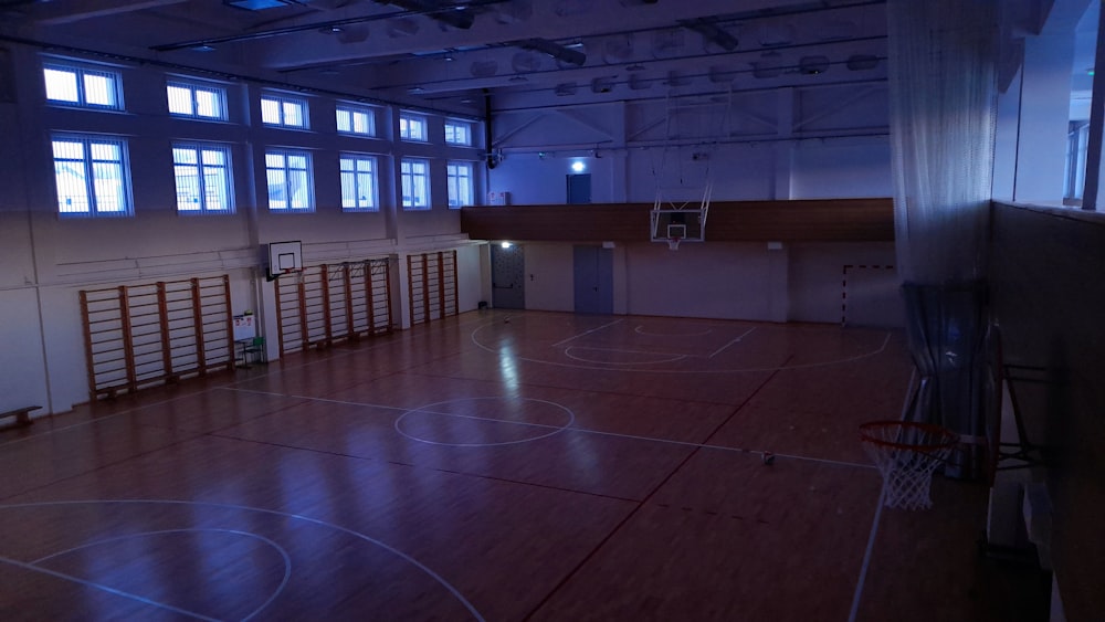 a basketball court with a basketball hoop in the middle of it