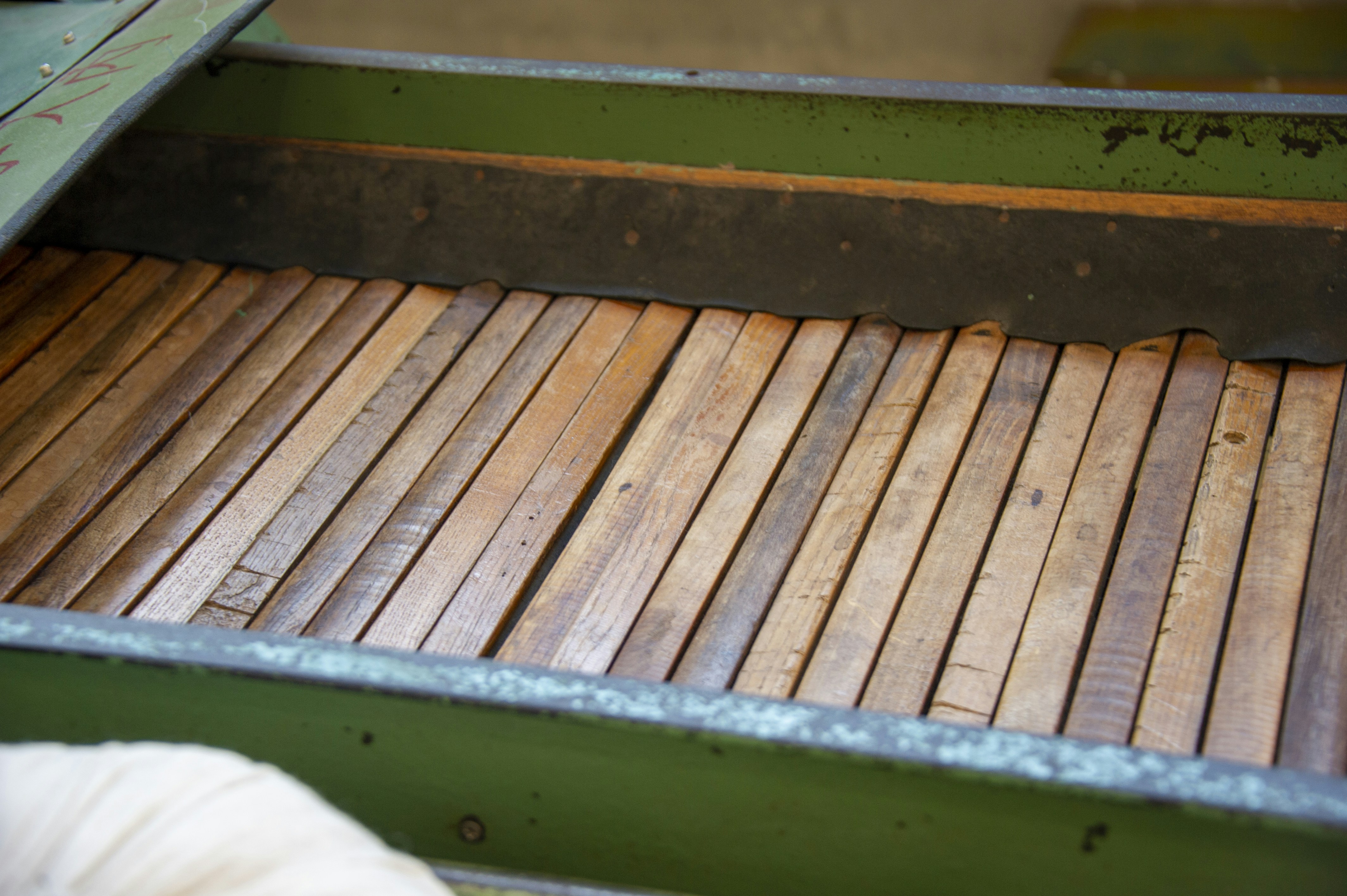 a close up of a bench made out of wooden planks