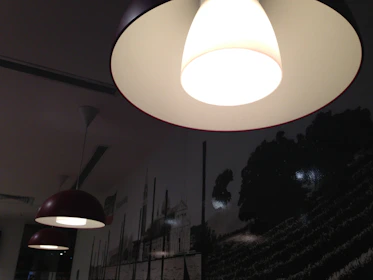 a white light hanging from a ceiling in a room