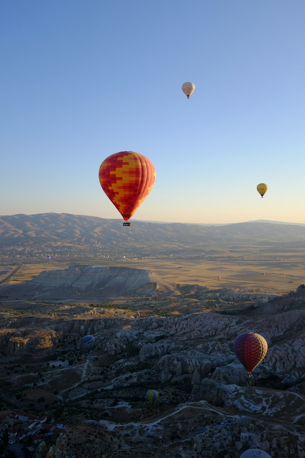 a group of hot air balloons flying in the sky