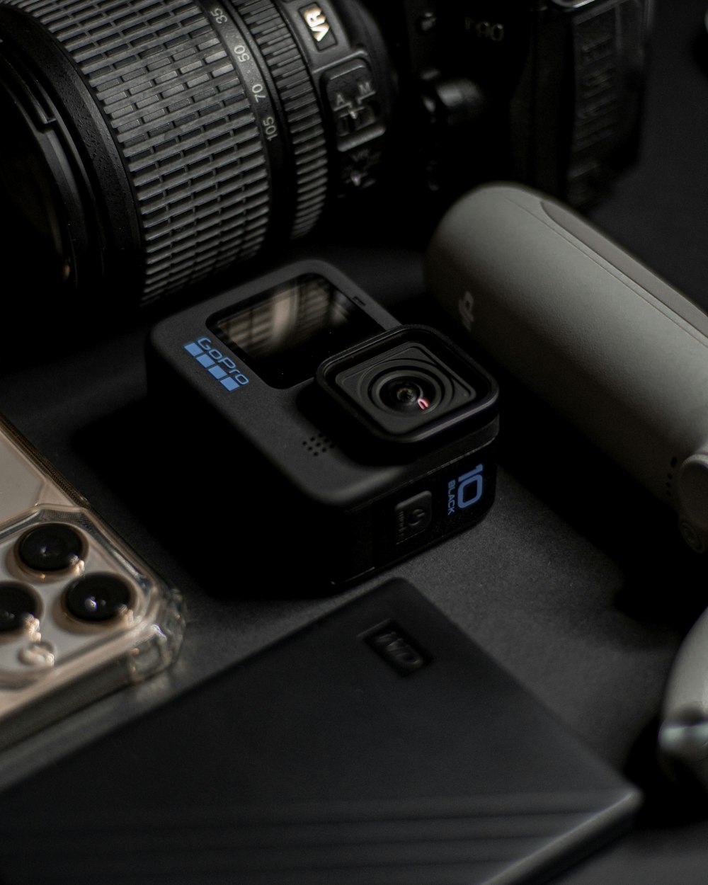 a couple of cameras sitting on top of a table