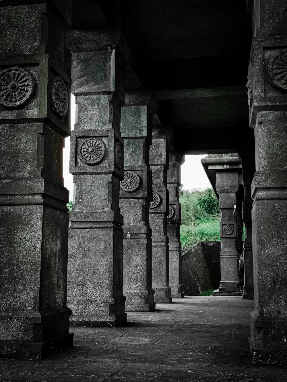 a black and white photo of a walkway