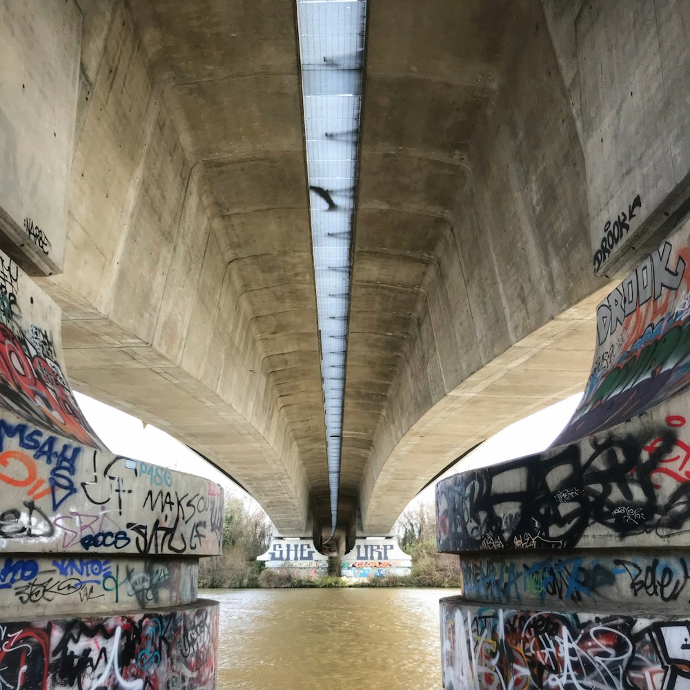 a bridge that has some graffiti on it