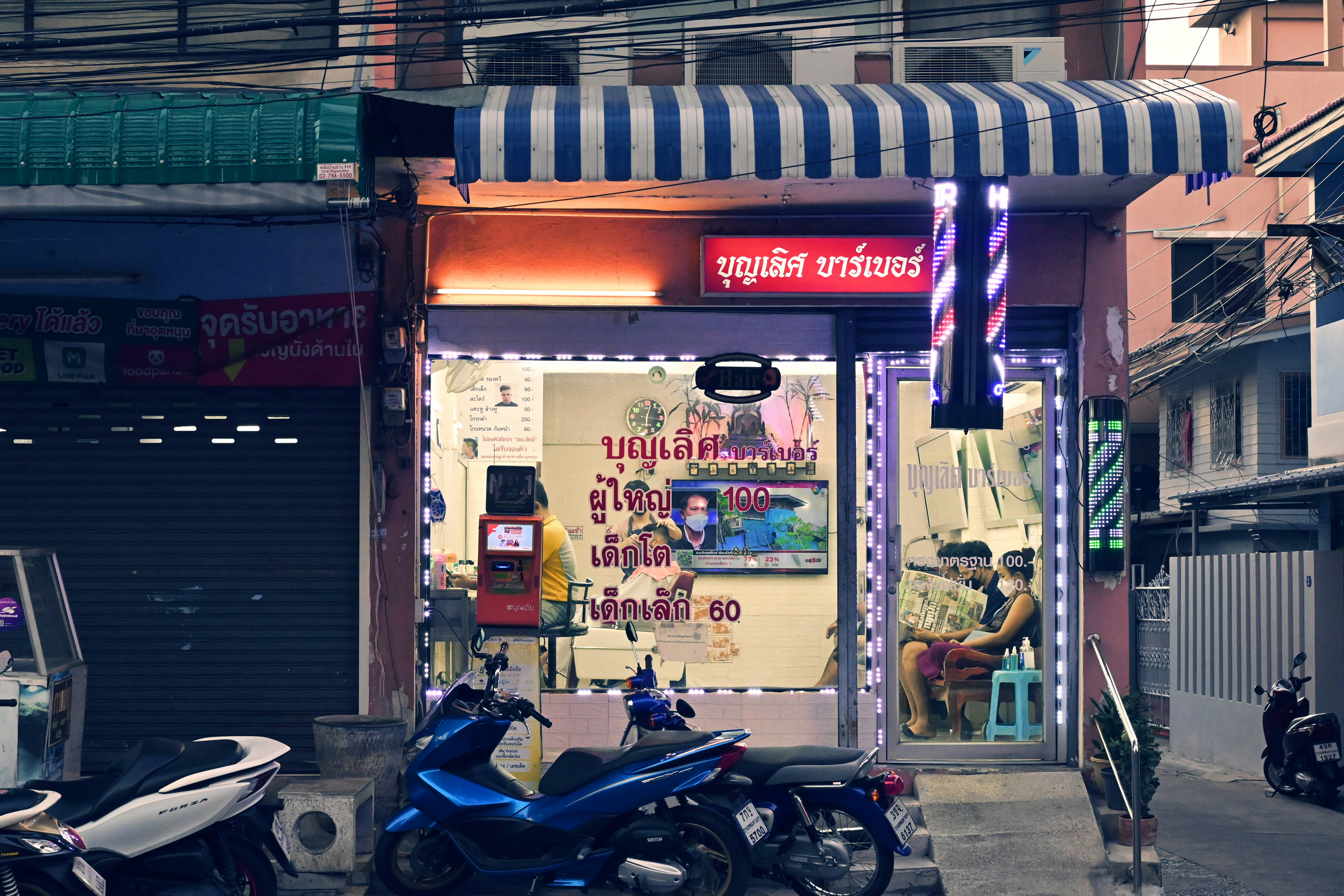 a couple of motorcycles parked in front of a building