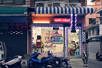 a couple of motorcycles parked in front of a building