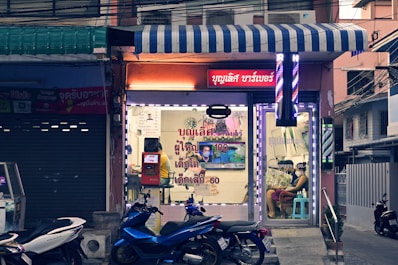a couple of motorcycles parked in front of a building