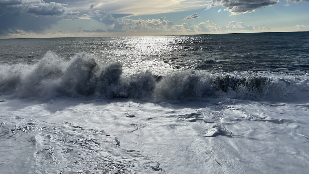 a large body of water surrounded by snow