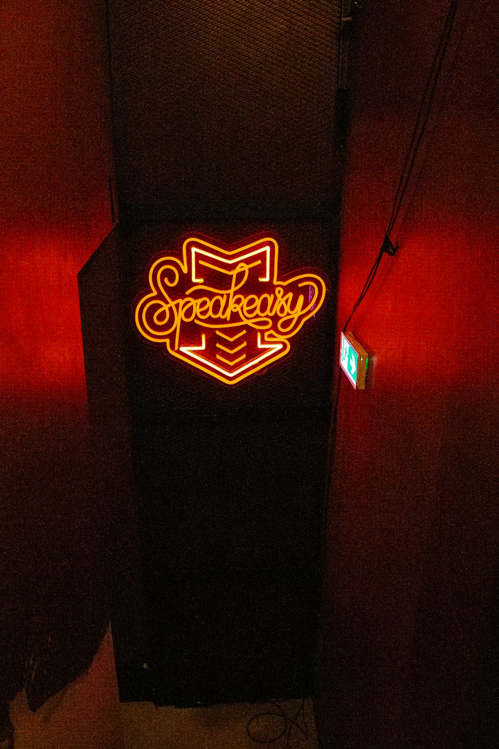 a neon sign that is on the side of a building