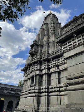 a very tall building with a clock on it's side