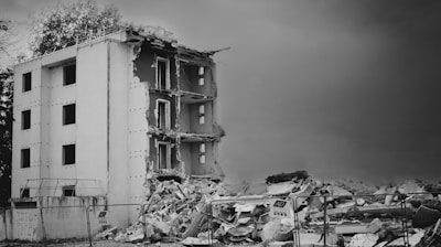 a black and white photo of a demolished building
