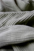 Stretchy rib knit fabric swatched neatly, highlighting ribbed patterns.