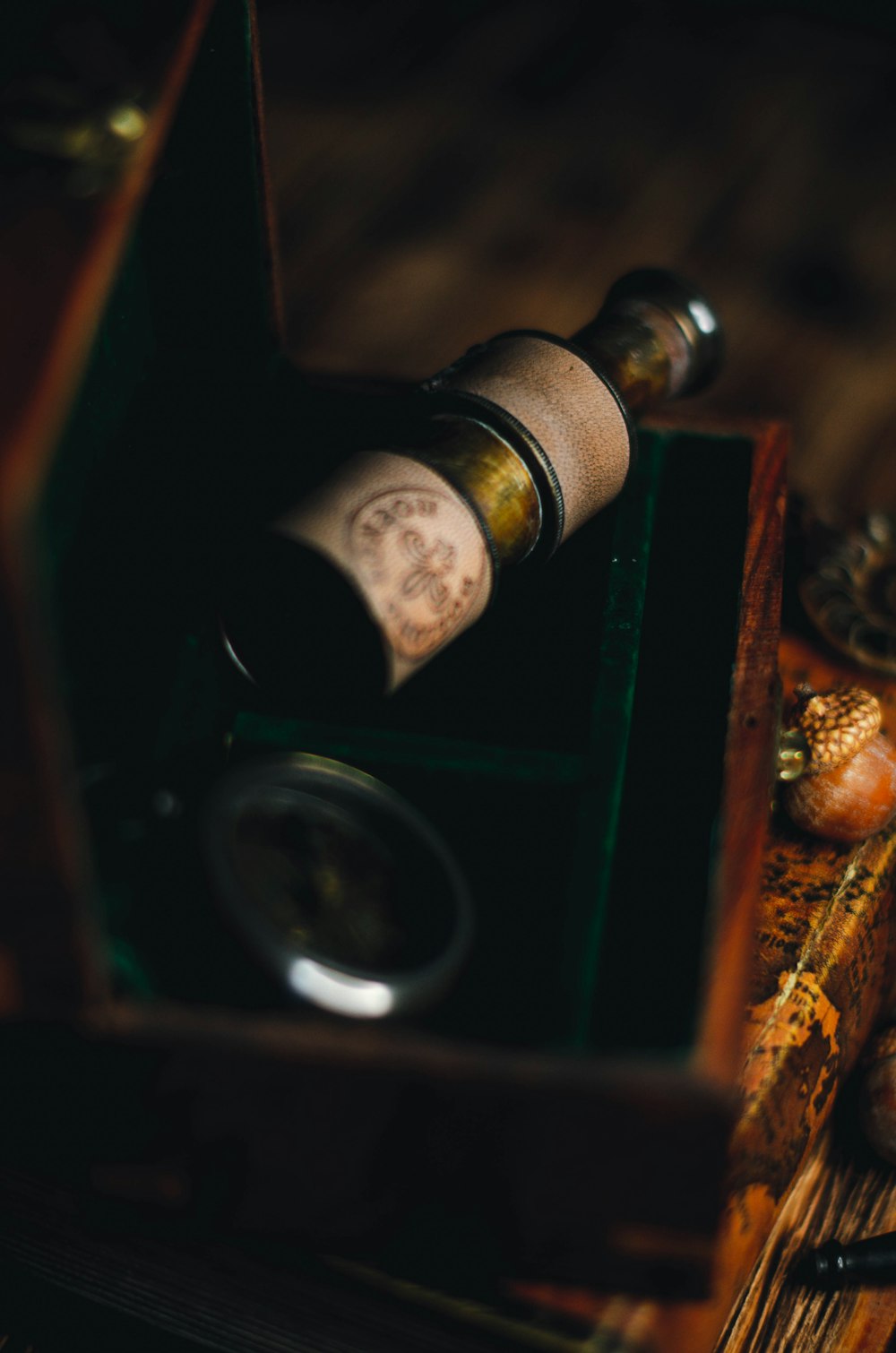 a bottle of wine sitting inside of a wooden box