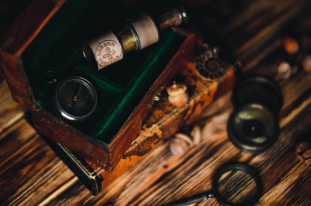 a wooden box with two bottles of wine inside of it