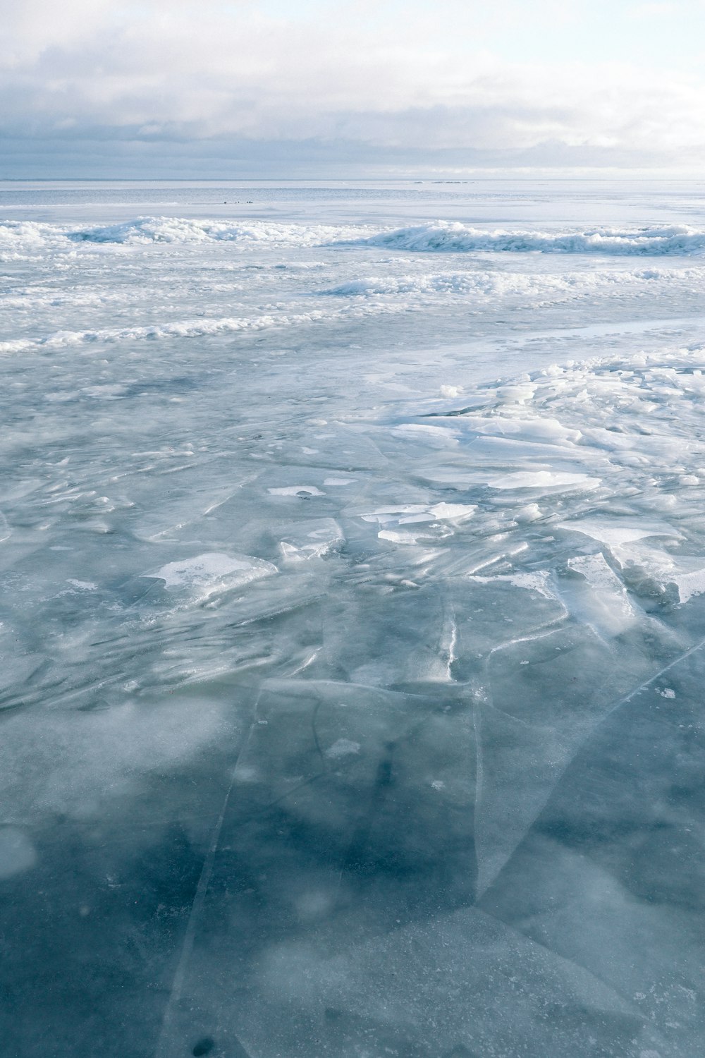 a large expanse of ice floating on top of a body of water