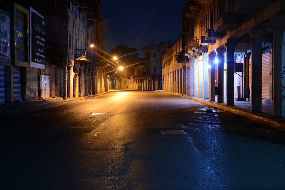 an empty street at night with no one on it