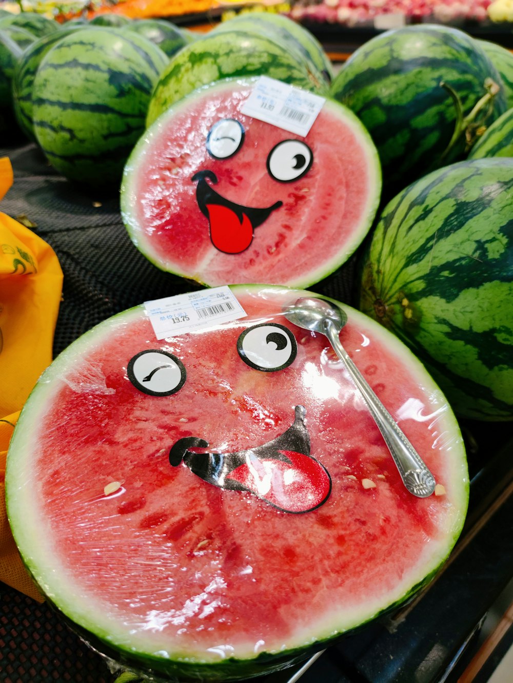 a watermelon with a face drawn on it