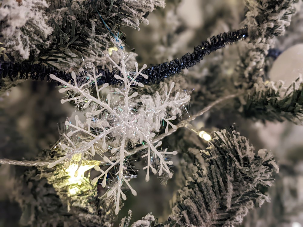 a close up of a snowflake on a christmas tree