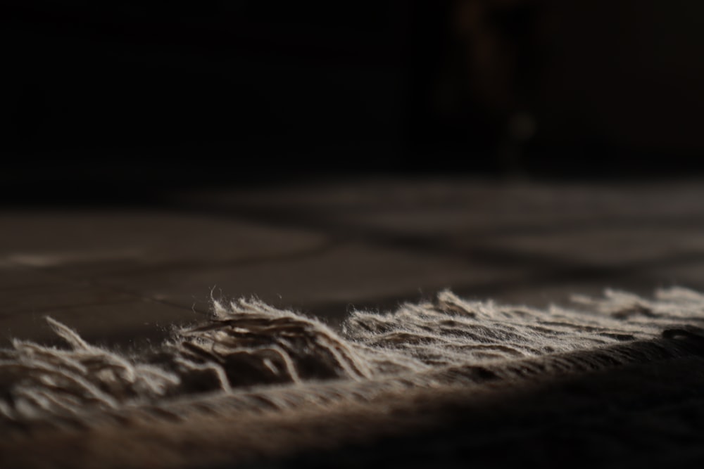 a close up of a carpet with a blurry background