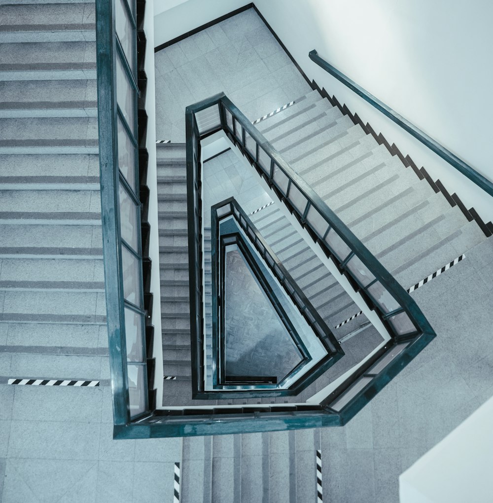 a spiral staircase with metal handrails in a building