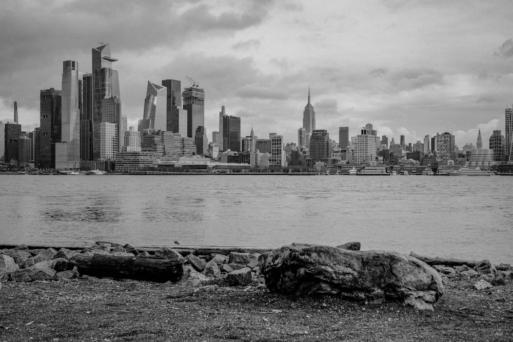 a large body of water with a city in the background