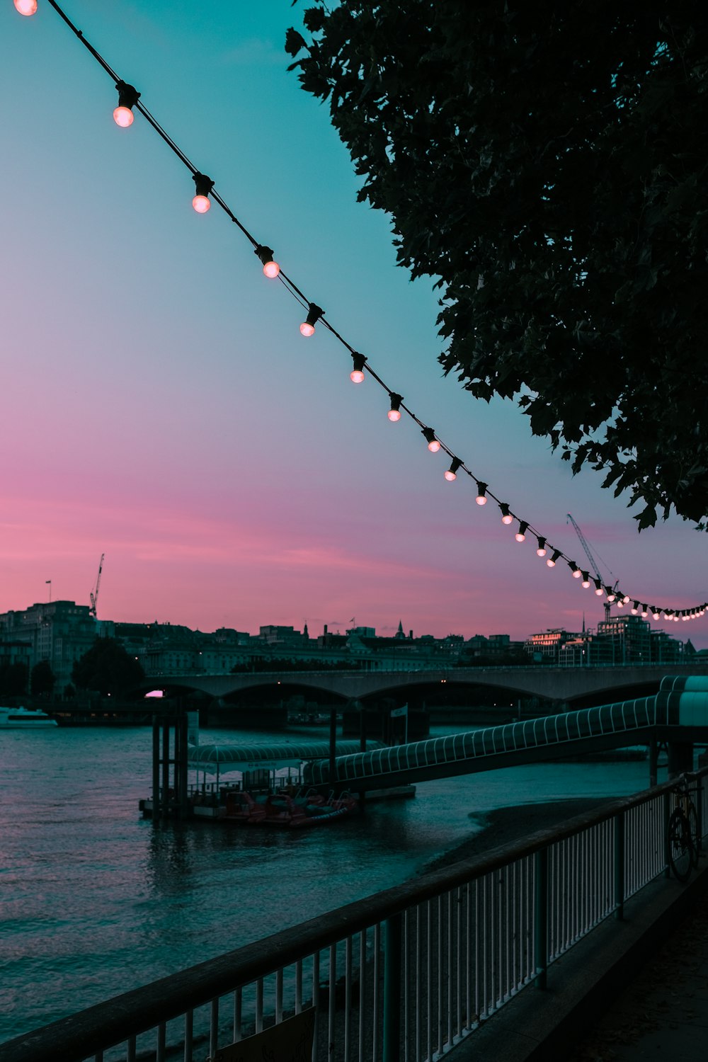 a view of a river with a bridge in the background