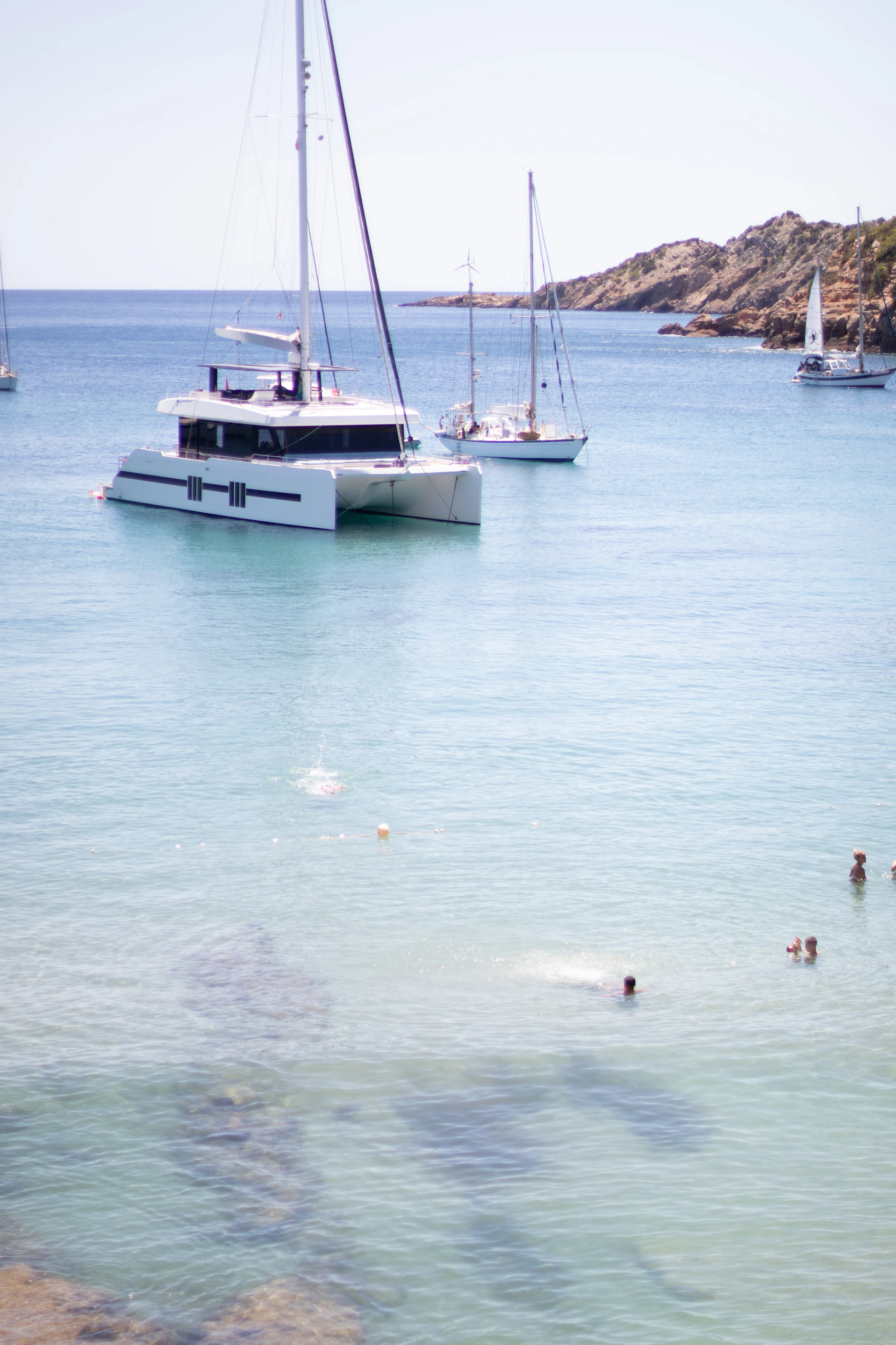 a group of people swimming in a body of water