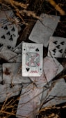 a pile of playing cards laying on top of each other