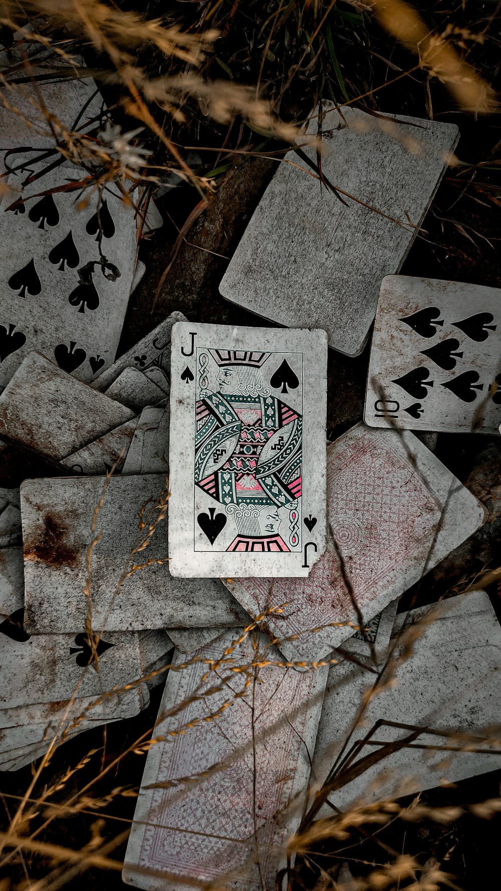 a pile of playing cards laying on top of each other