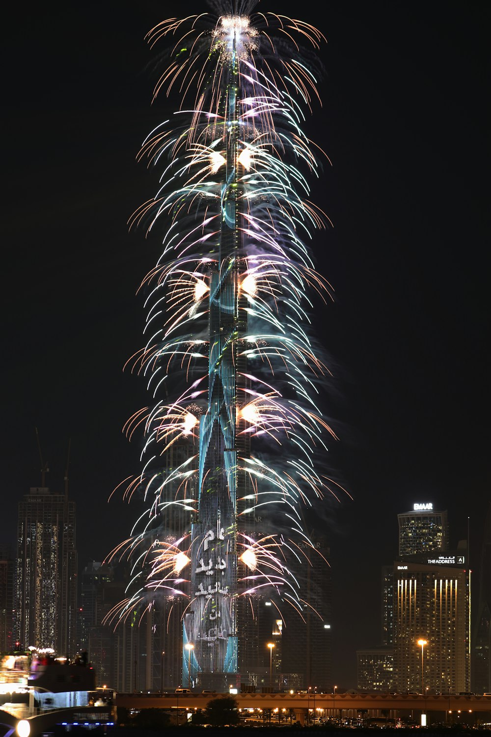 a very tall building with a lot of fireworks in the sky