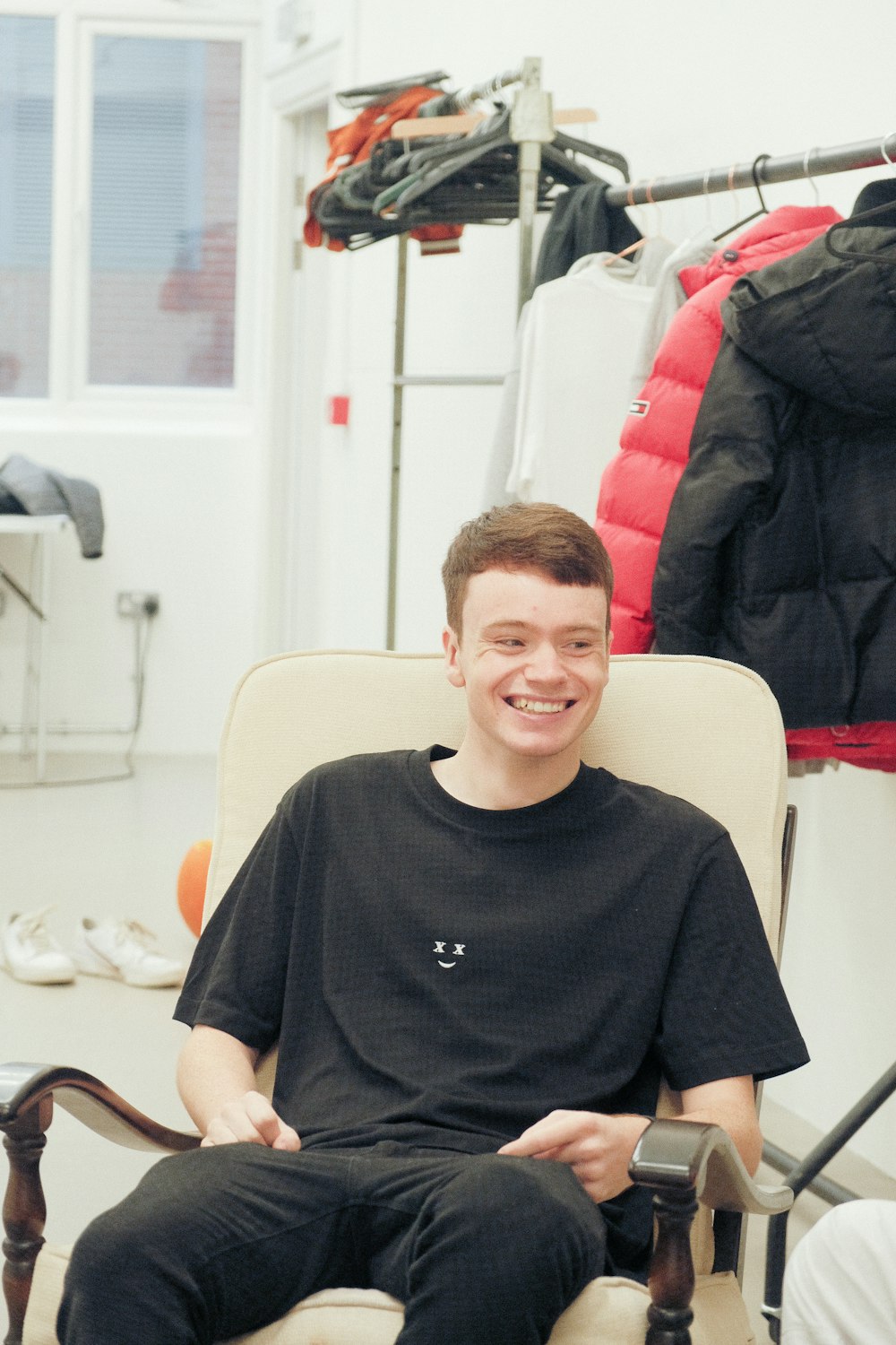 a man sitting in a chair in a room