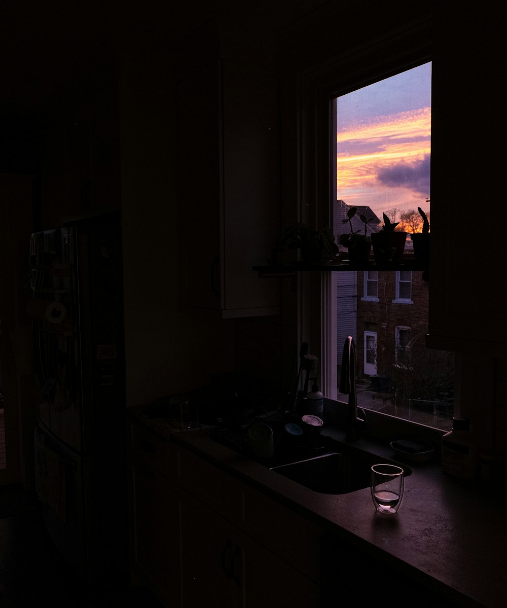 a kitchen with a sink and a window