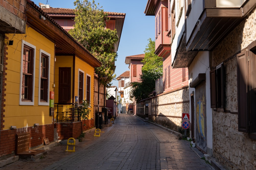 a narrow street lined with brick buildings