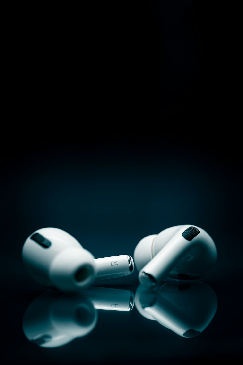 a pair of ear buds sitting on top of a table