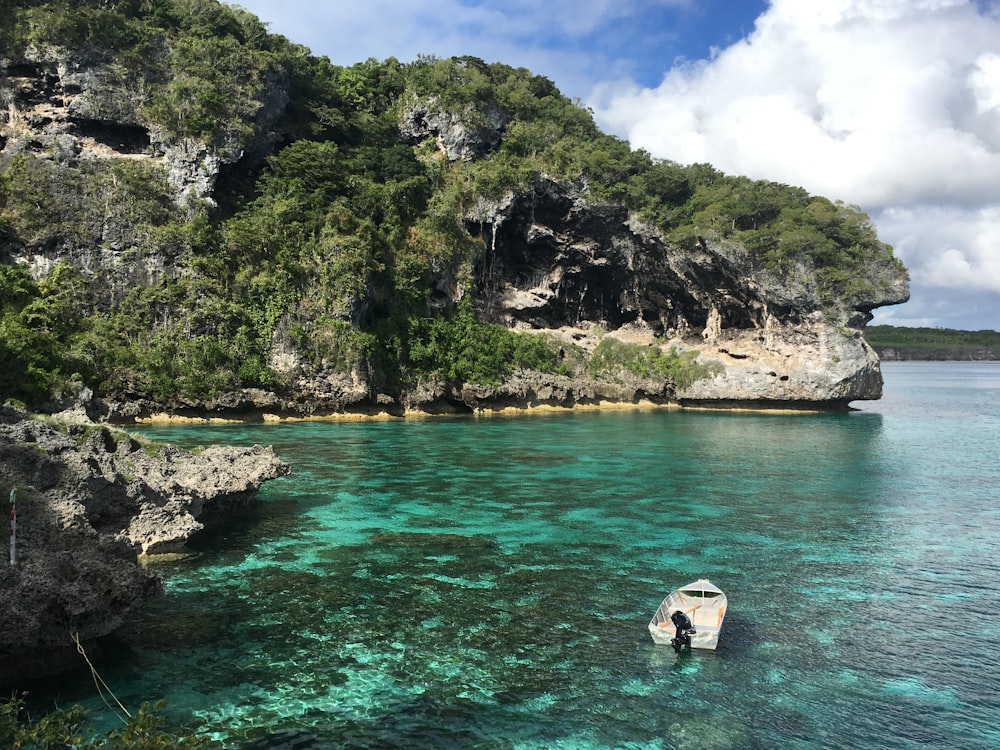 a boat floating on top of a body of water